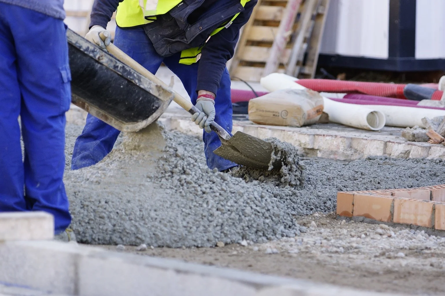 Construction Highway Workers Using Crushed Stone